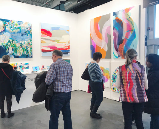 Abstract paintings at art fair.