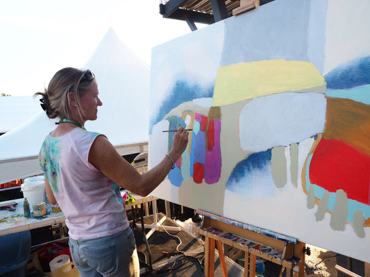 Abstract artist, Claire Desjardins, painting on art canvas at easel.