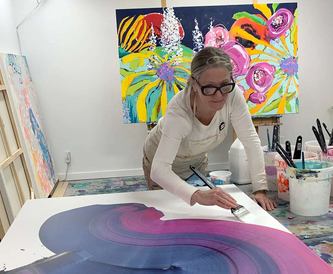 Artist Claire Desjardins, painting in her art studio.