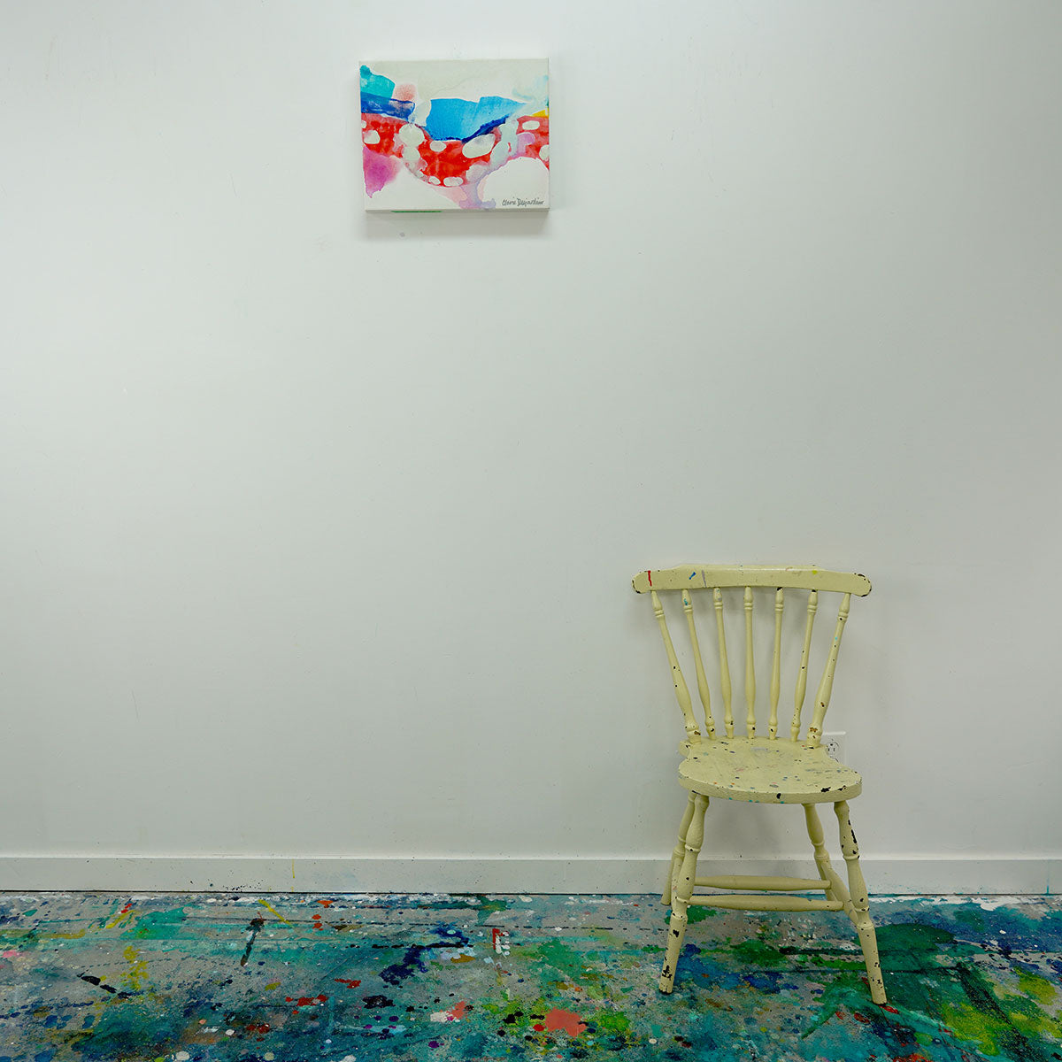 Original abstract painting, I Tiptoes Across, by Canadian abstract artist, Claire Desjardins. Hung on white studio wall with chair for scale.