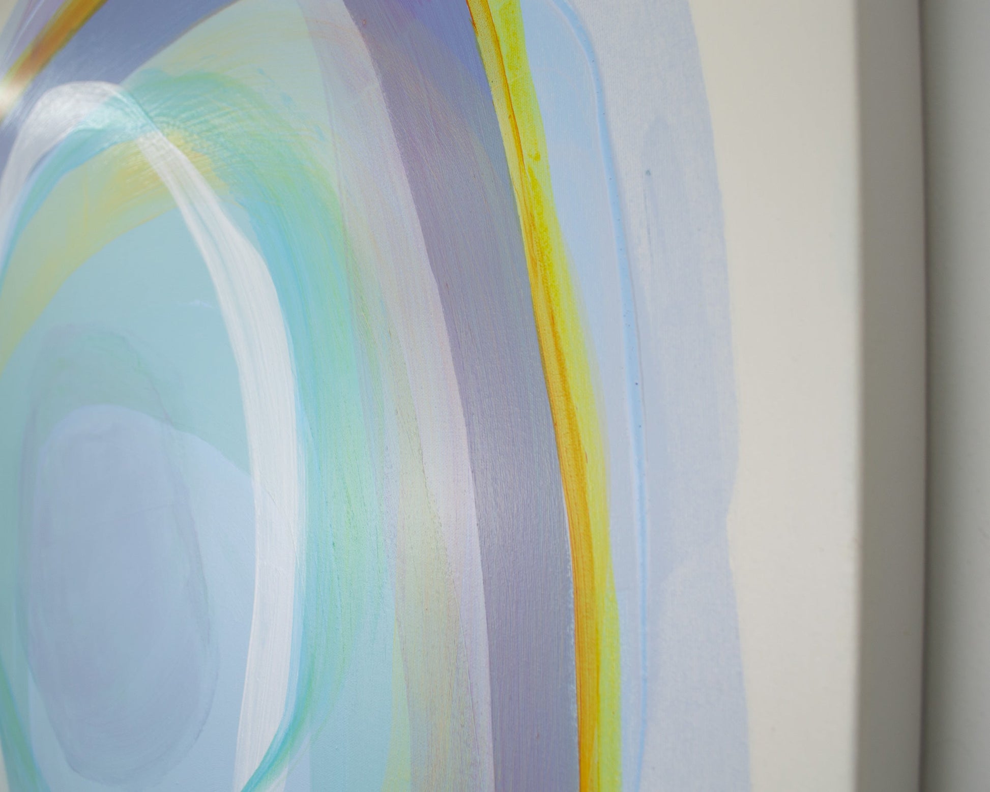 Abstract art with curved lines in blue, green, and yellow on a white background