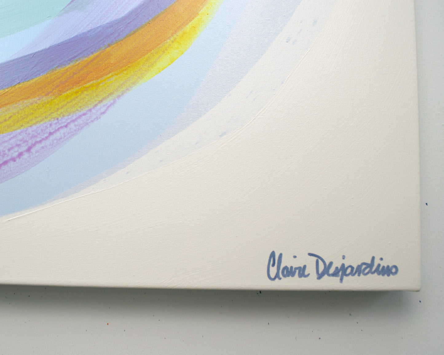 Artistic signature on a piece of paper with colorful abstract design