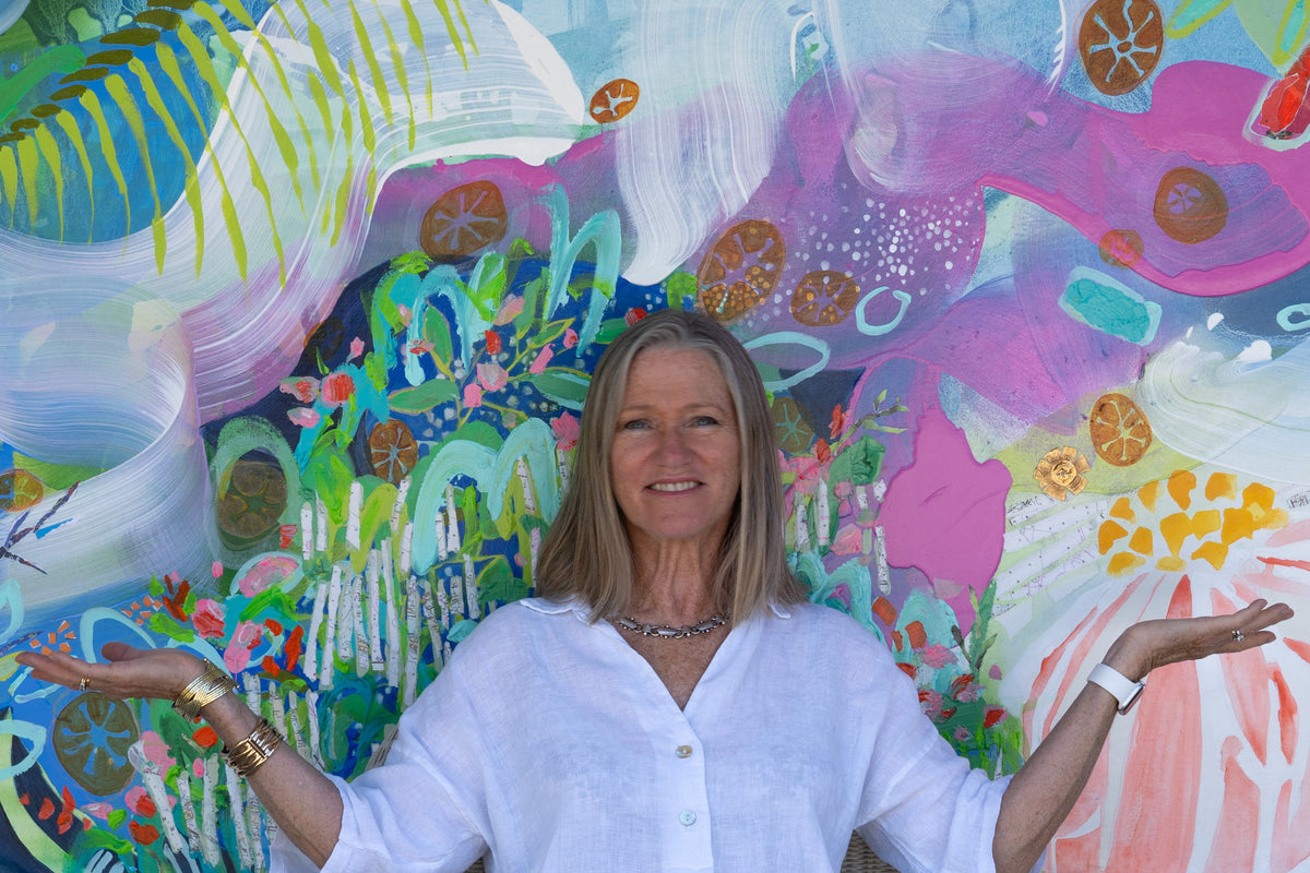 Canadian abstract painter, Claire Desjardins, in front of her painting, My Tropical Paradise